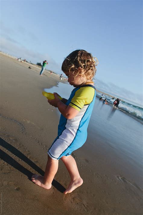 Boy Heads Away From Ocean By Stocksy Contributor Jayme Burrows