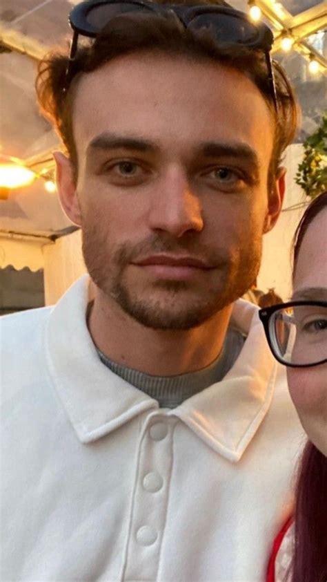 a man and woman are posing for a photo