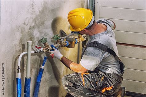 Plumbing Services Plumber At Work Stock Photo Adobe Stock