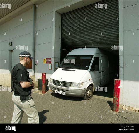 Armed Policemen And Robbery Suspects At The Scene Of An Attempted 30