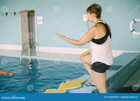 Mature Woman Coach With Whistle By Poolside Stock Image Image Of