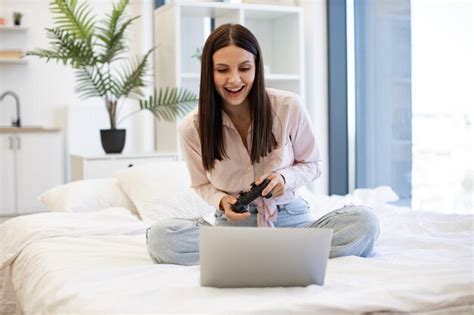 Premium Photo Caucasian Brunette Using Modern Devices Enjoying Favorite Video Game On Weekend