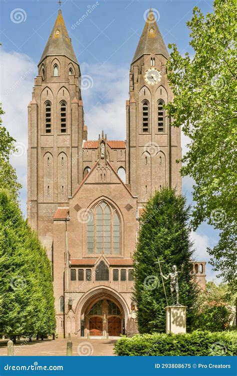 A Church With Two Towers And A Statue In Front Stock Image Image Of
