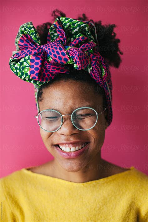 Beautiful Woman With Head Scarve Posing In Front Of A Pink Backg By Stocksy Contributor Mak