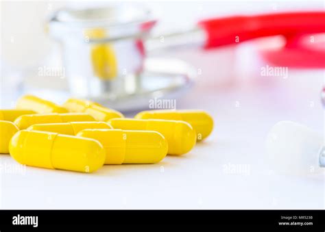 Closeup Yellow Pills Capsule With Stethoscope Background Medical And