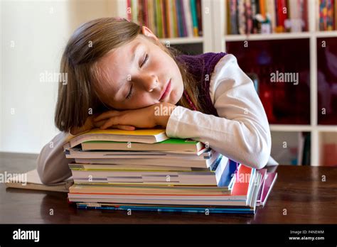 Girl Sleeping On Stack Of School Books Stock Photo Alamy