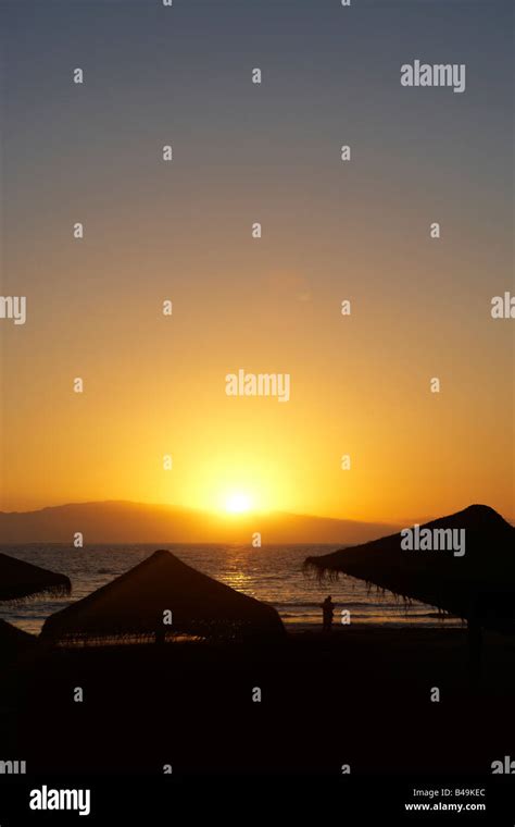 Sunset over tenerife beach Stock Photo - Alamy