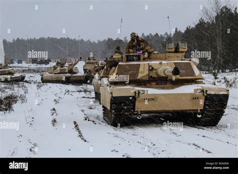 Battle Group Poland Preforms Winter Live Fire Training During Operation