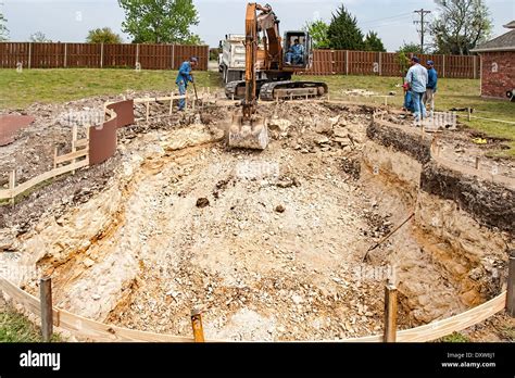 Digging A Pool In The Backyard With A Backhoe Stock Photo Alamy