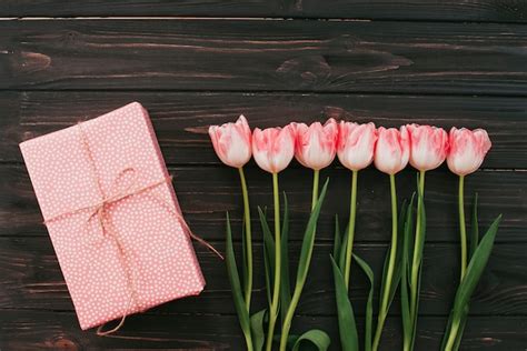 Free Photo Tulips With Gift Box On Wooden Table