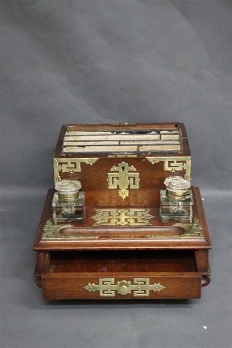 An Old Wooden Box With Two Jars On It