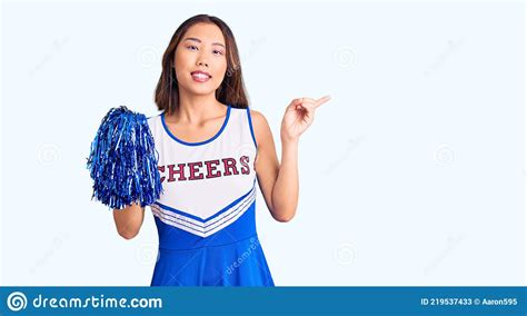 Young Beautiful Chinese Girl Wearing Cheerleader Uniform Holding Pompom