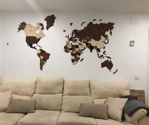 A Living Room With A Couch And A World Map On The Wall