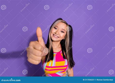 Photo Of Satisfied Lovely Cute Girl Wear Trendy Clothes Showing Thumb