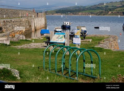 Boats Moored In The Shelter Of Trefor Harbour Behind An Information