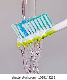 Toothbrush Under Running Water Use Dental Stock Photo 1028145283 | Shutterstock