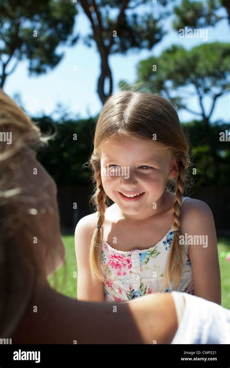 Girl outdoors, smiling Stock Photo - Alamy