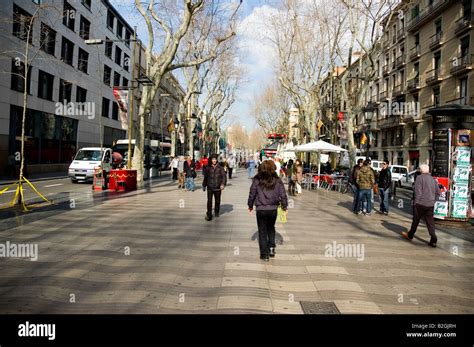 las ramblas people walk, Barcelona Spain Stock Photo - Alamy