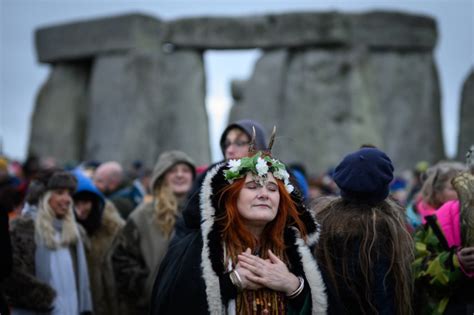 Revelers celebrate the Winter Solstice in England and Ireland