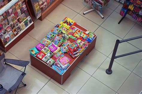 Sale of children's books in supermarket. Top view Photograph by Aleksandr Volkov - Pixels