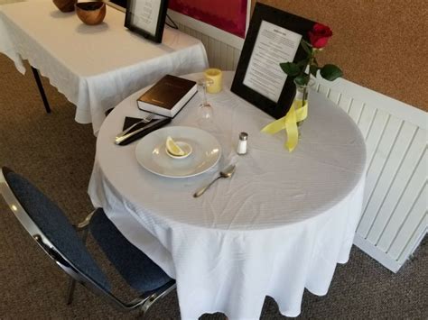 missing man table hillside church  god