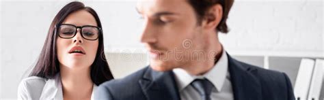 Brunette Secretary Seducing Businessman While Unbuttoning Stock Image