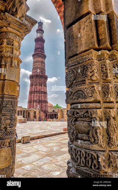 Qutb Minar Seen Through An Arch In The Mehrauli Quwwat Ul Islam Mosque