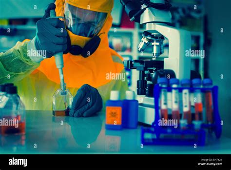 Scientist in hazmat suit Stock Photo - Alamy