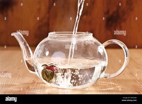 Pouring Hot Water Into Teapot Close Up Stock Photo Alamy