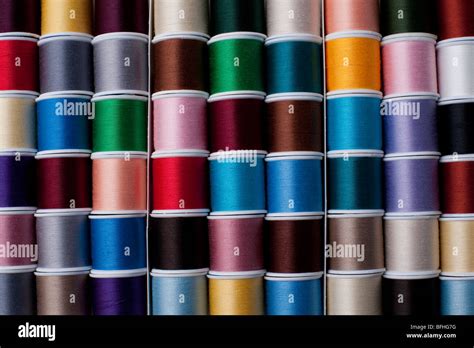 Bright Colored Spools Of Thread In Rows Stock Photo Alamy