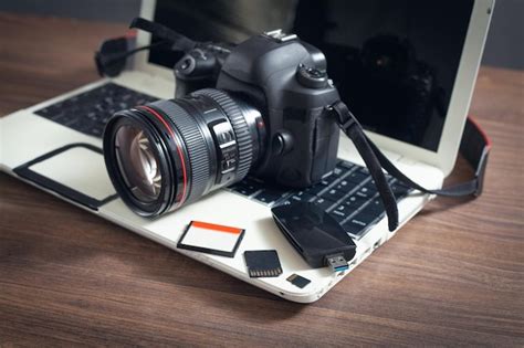 Premium Photo Modern Dslr Camera And Laptop Computer