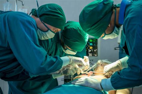 Premium Photo Close Up Of An Operating Surgery Team A Team Of