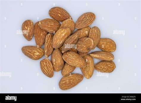 Heap Of Almond Nuts Isolated On White Background Stock Photo Alamy