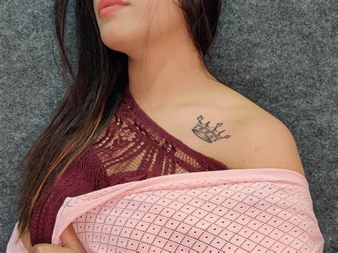 The Hidden Meaning Behind A Girl S Shoulder Crown Tattoo Revealed