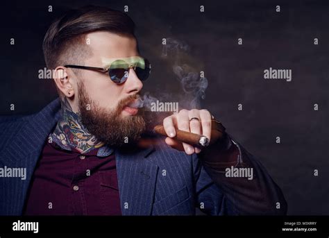 A Man In Sunglasses Smoking A Cigar Stock Photo Alamy