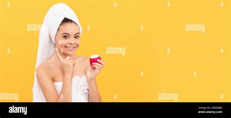 Smiling Teen Girl In Shower Towel Apply Facial Cream Cosmetics And