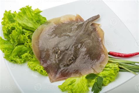 Raw Batoidea on the plate and white background 11239945 Stock Photo at ...