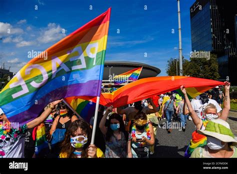 Supporters Wearing Protective Face Masks Holding Rainbow Flags During