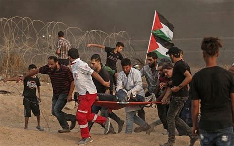 More than 100 Palestinians wounded in clashes at Gaza-Israel border ...