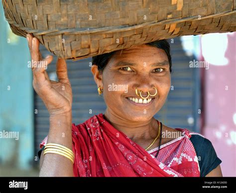 Indian Adivasi Woman Dongria Kondh Tribe With Three Golden Nose Rings And Golden Tribal