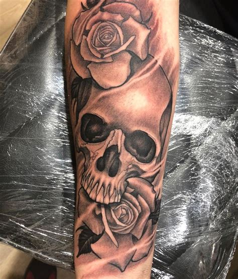 Skull With Roses Tattoo For Girls