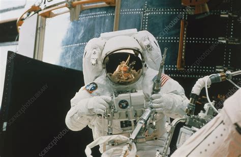 Astronaut spacewalks to repair Hubble Telescope - Stock Image - S540 ...