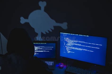 Computer Hacker Silhouette Of Hooded Man Using Laptop And Monitor For