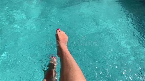 Beautiful Sporty Slim Woman Legs Relaxing In Water Swimming Pool Spa