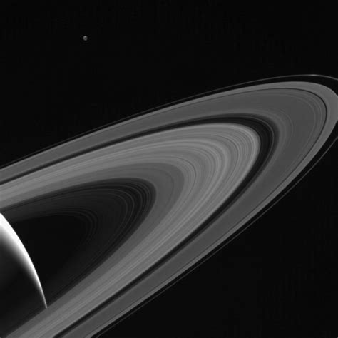 NASA S Cassini Spacecraft Views A Saturn Lit Tethys