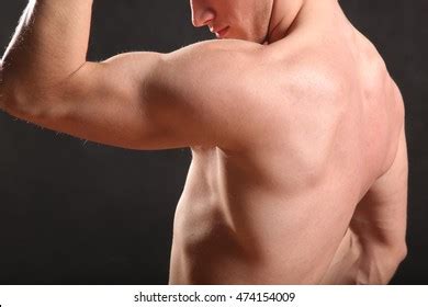 Стоковая фотография 474154102 Nude Male Torso Muscle On Black