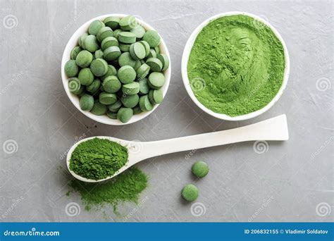 Chlorella or Spirulina in the Form of Tablets and Powder on a Gray ...