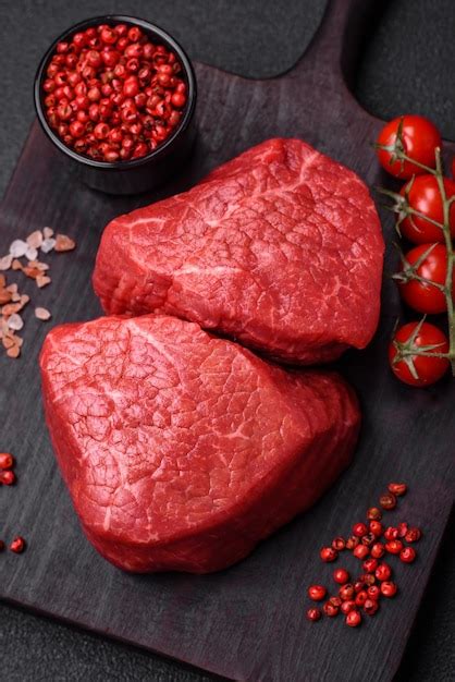 Premium Photo Fresh Juicy Raw Beef Medallions With Salt And Spices On