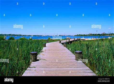 USA, Rhode Island, boardwalk leading to Great Salt Pond on Block Island ...