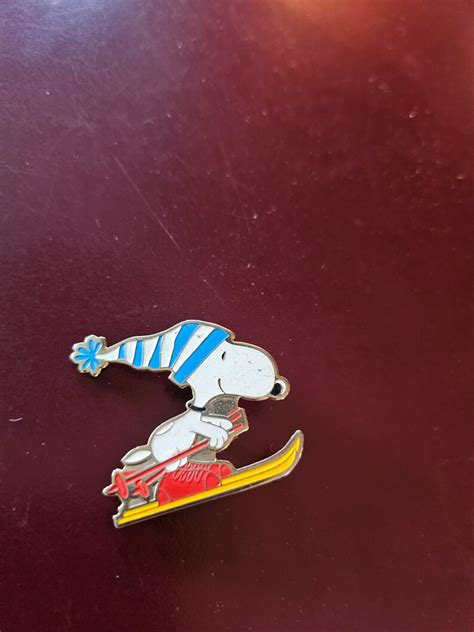 So 70s Pins72 Skiing Snoopy And Praying Little Angel Etsy